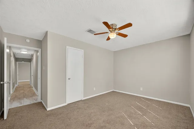 a view of a big room with carpet