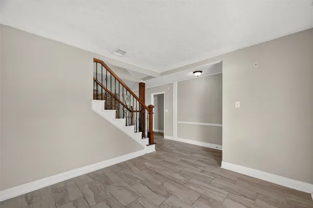 a view of entryway with wooden floor