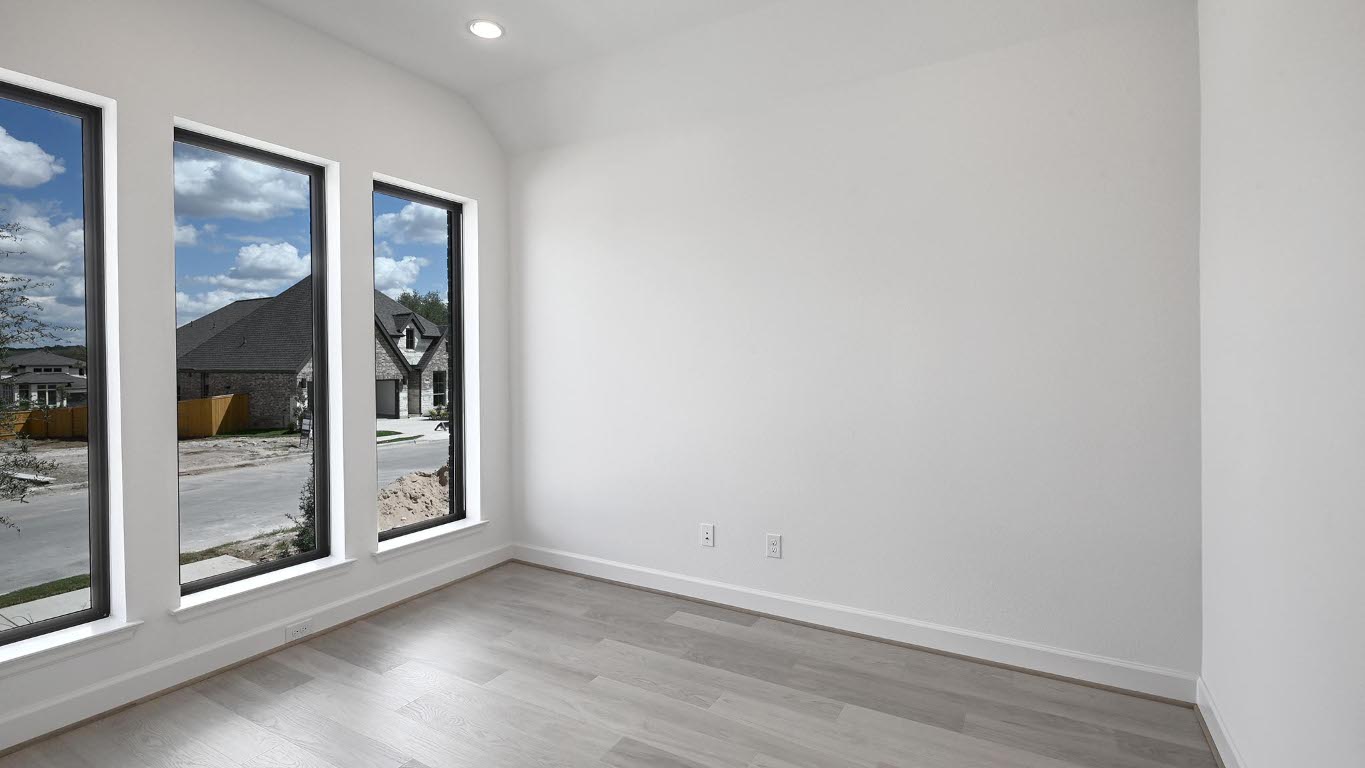 175 High Rock Pass Kyle, TX 78640 - Photo 16 of 39 Empty room featuring light wood-style floors, vaulted ceiling, and recessed lighting