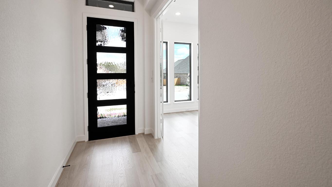 175 High Rock Pass Kyle, TX 78640 - Photo 18 of 39 Entrance foyer with a textured wall and light wood-style flooring