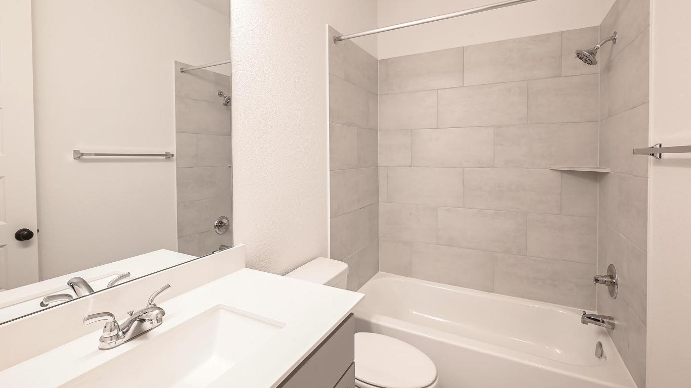 175 High Rock Pass Kyle, TX 78640 - Photo 21 of 39 Full bathroom with washtub / shower combination and vanity