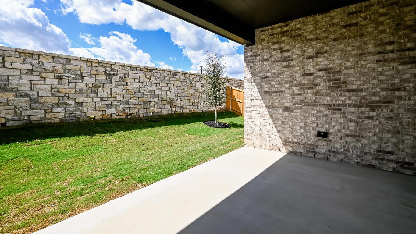 175 High Rock Pass Kyle, TX 78640 - Photo 25 of 39 Fenced backyard with a patio area