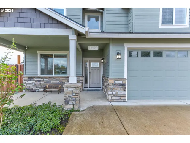 a backyard of a house with outdoor seating