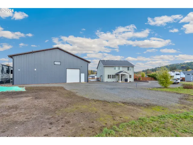 an aerial view of a swimming pool and lake view
