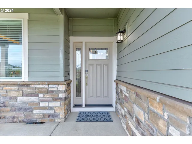 a view of wooden door and a window