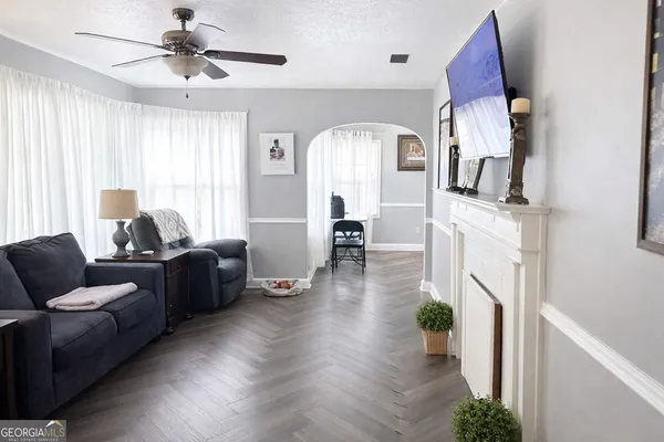 a living room with furniture and a fireplace