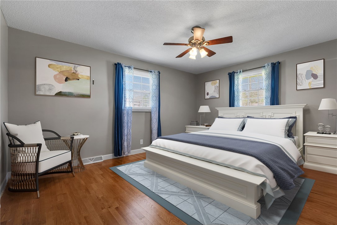 300 Green Street Williamston, SC 29697 - Photo 12 of 47 This spacious bedroom offers ample natural light and comfortable wood flooring, creating a relaxing retreat.