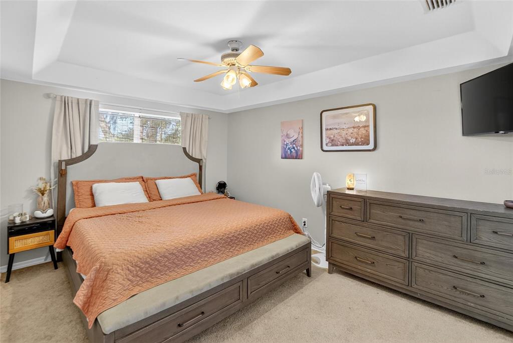 630 Cape Cod Circle Valrico, FL 33594 - Photo 19 of 48 a bedroom with a bed and a flat screen tv