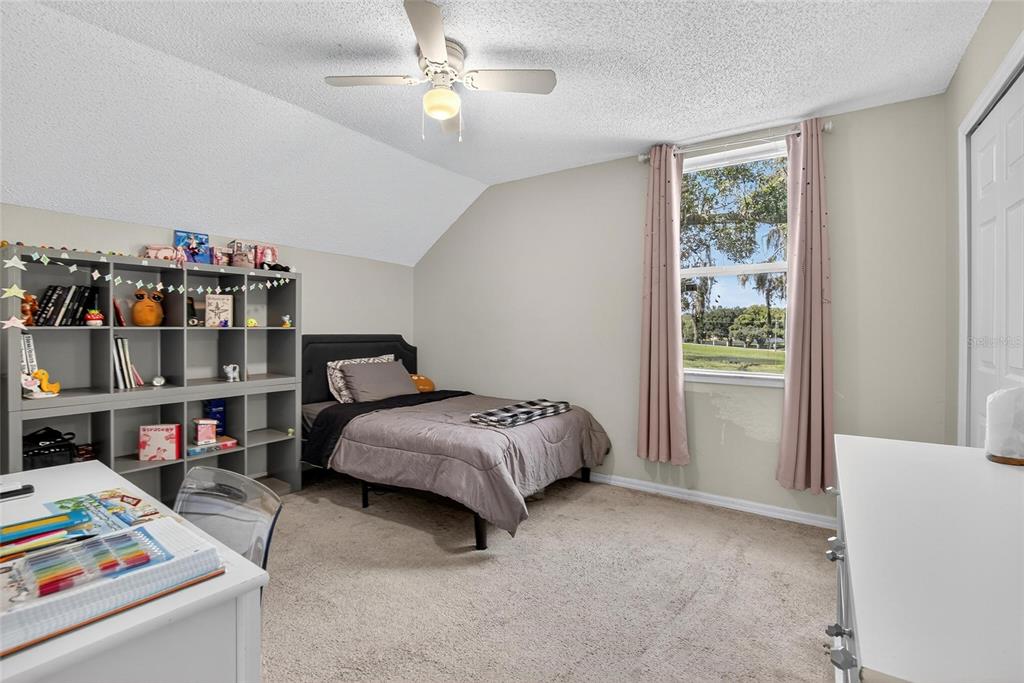 630 Cape Cod Circle Valrico, FL 33594 - Photo 26 of 48 a bed room with a bed and a book shelf