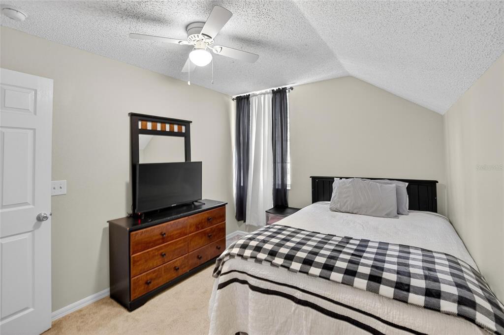 630 Cape Cod Circle Valrico, FL 33594 - Photo 31 of 48 a bedroom with a bed and a flat screen tv