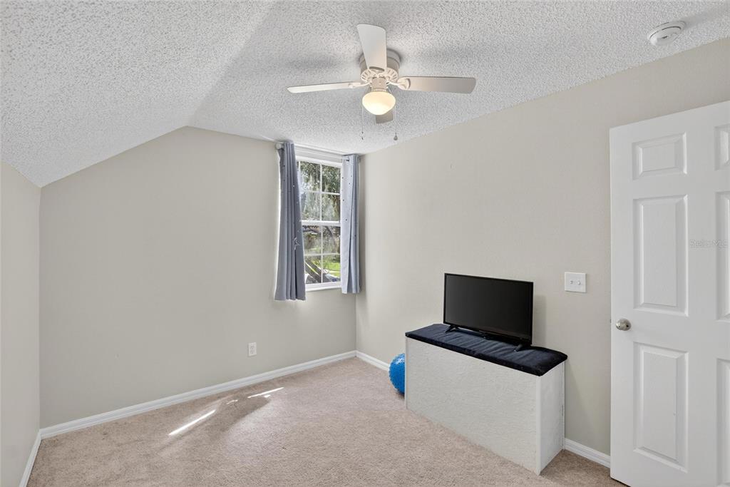 630 Cape Cod Circle Valrico, FL 33594 - Photo 34 of 48 a living room with furniture and a flat screen tv