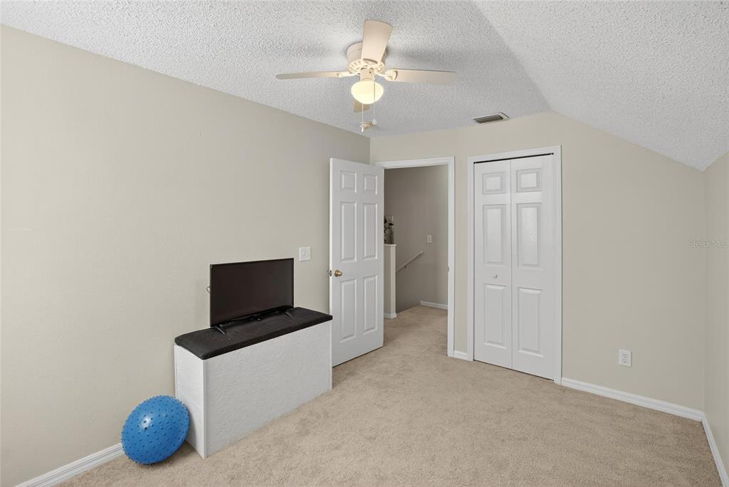 630 Cape Cod Circle Valrico, FL 33594 - Photo 35 of 48 a living room with furniture and a flat screen tv