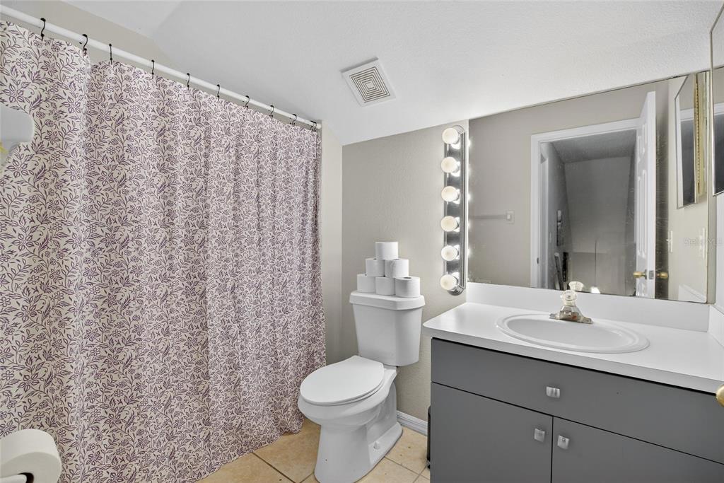 630 Cape Cod Circle Valrico, FL 33594 - Photo 36 of 48 a bathroom with a sink a toilet and shower curtain