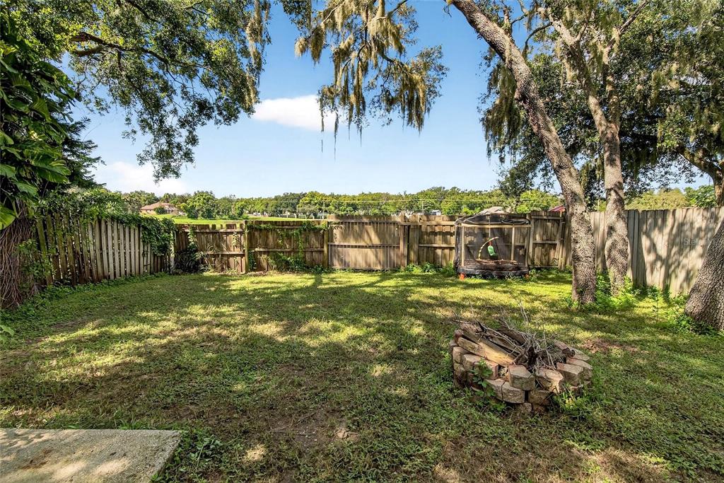 630 Cape Cod Circle Valrico, FL 33594 - Photo 41 of 48 a view of a large yard with swimming pool