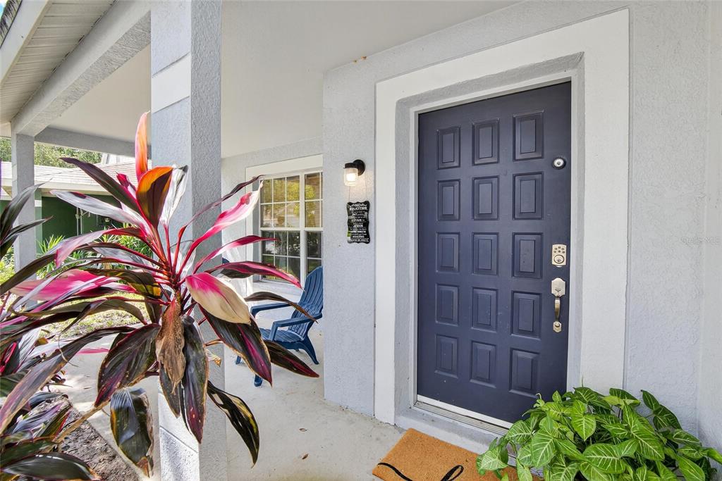 630 Cape Cod Circle Valrico, FL 33594 - Photo 7 of 48 a view of an entryway with a flower pot and wooden floor