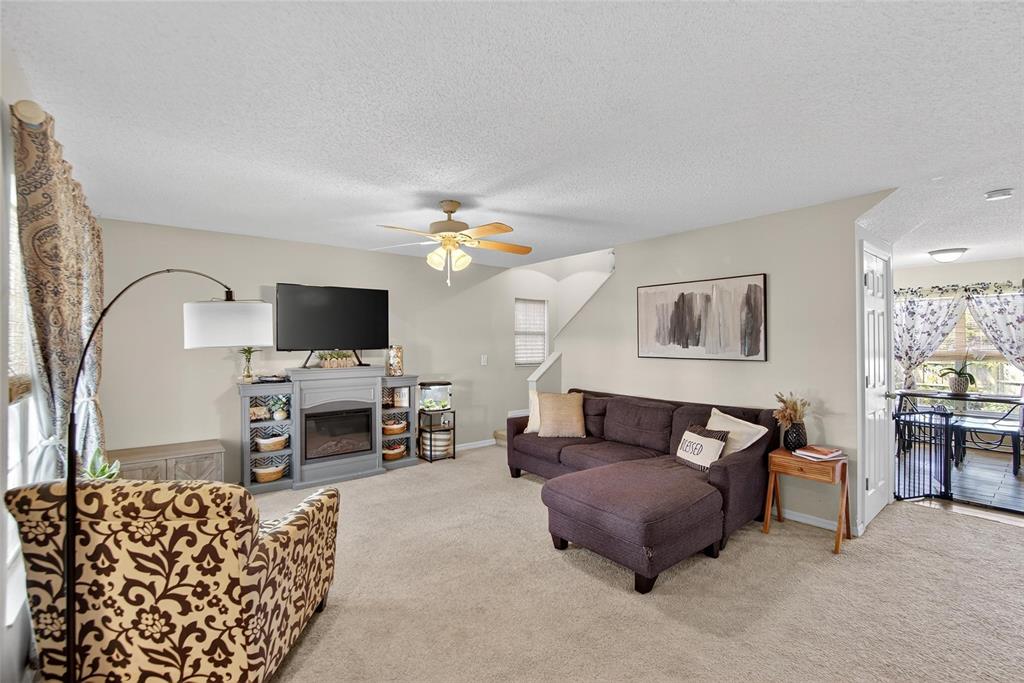 630 Cape Cod Circle Valrico, FL 33594 - Photo 9 of 48 a living room with furniture and a flat screen tv