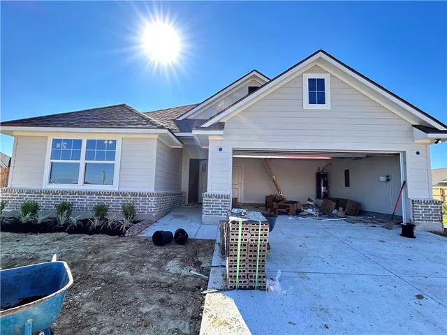 a front view of a house with seating space