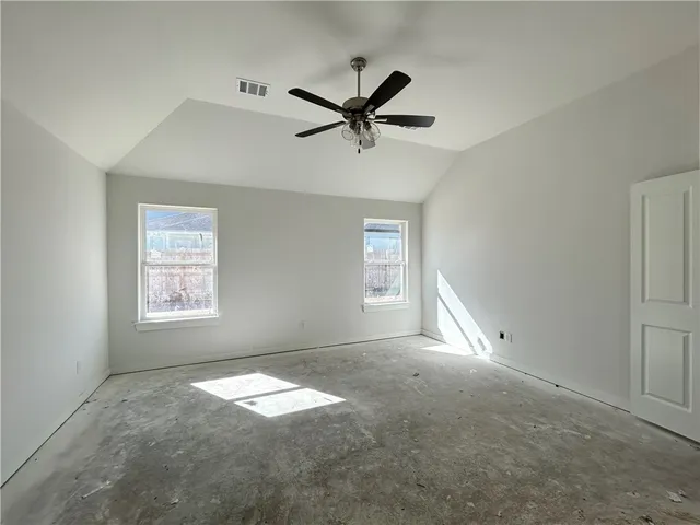 a spacious bathroom with a granite countertop sink and a mirror