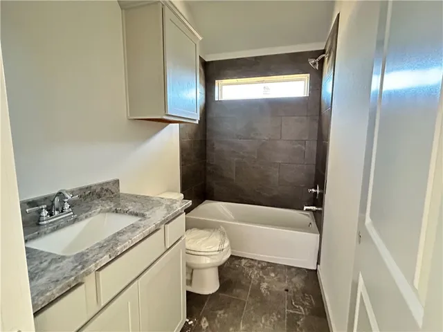 a blue room with window and a ceiling fan