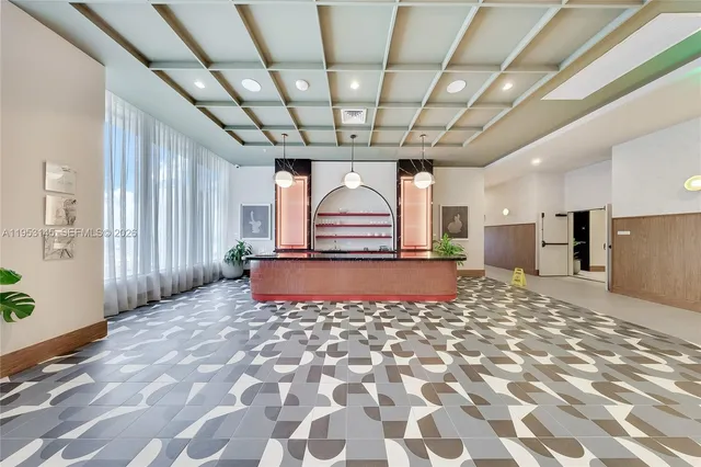a living room with furniture a ceiling fan and a rug