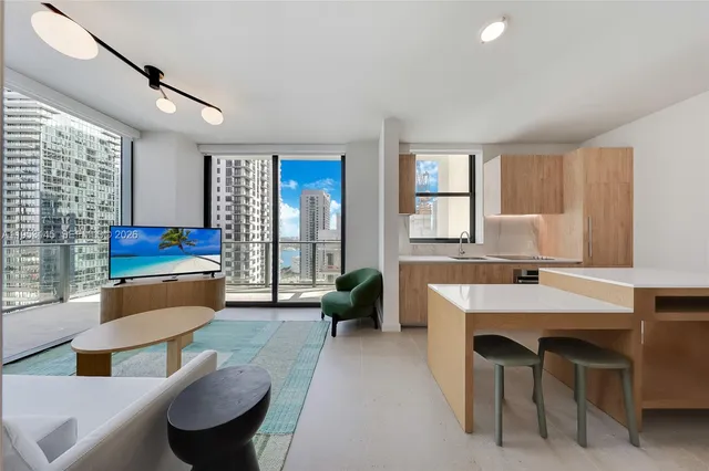 a view of a patio with couches and table and chairs and potted plants