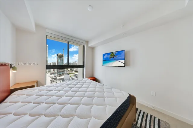 a spacious bathroom with a tub sink and mirror