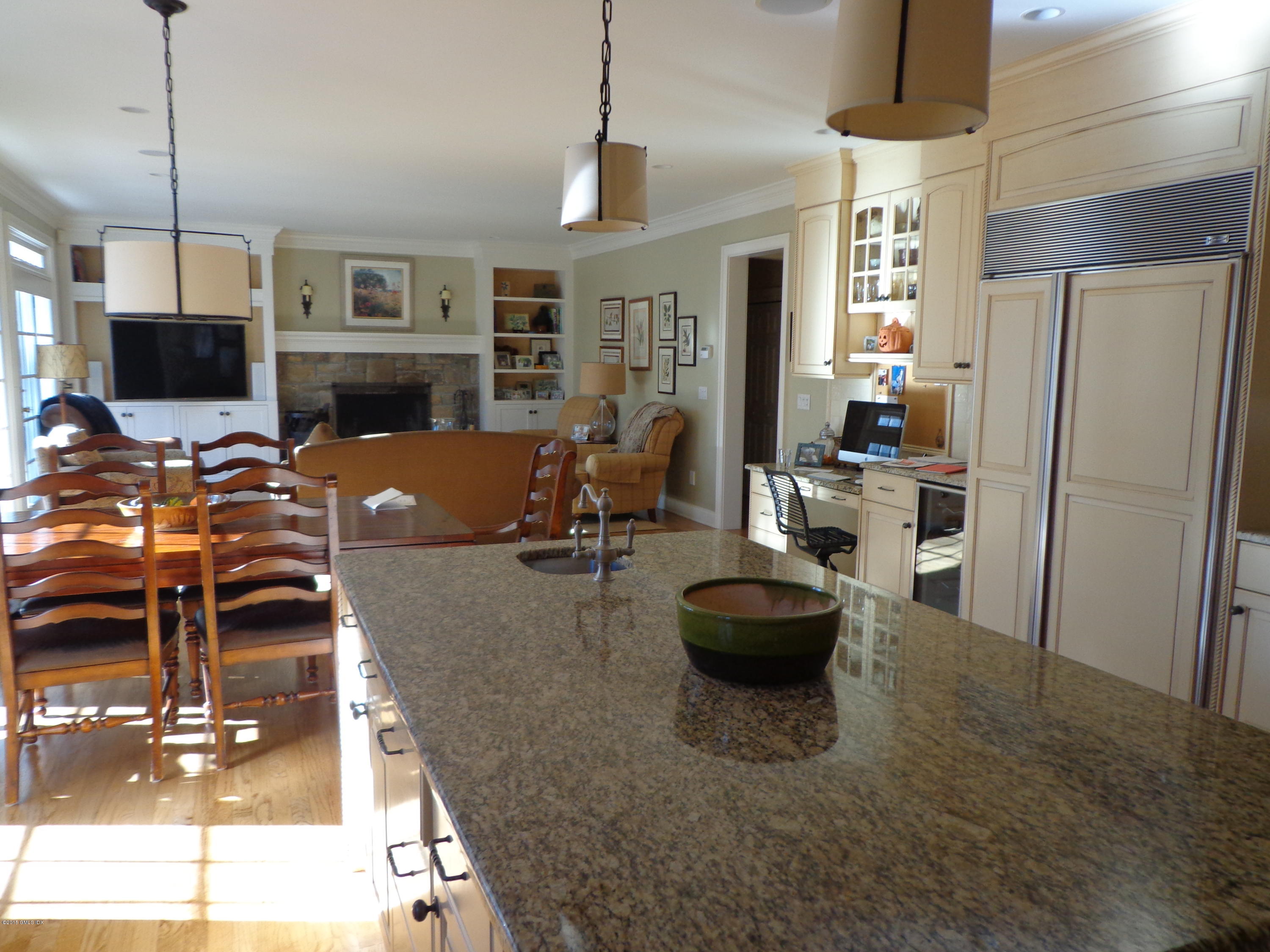 274 Palmer Hill Road Riverside, CT 06878 - Photo 8 of 23 a living room with furniture a flat screen tv and a fireplace