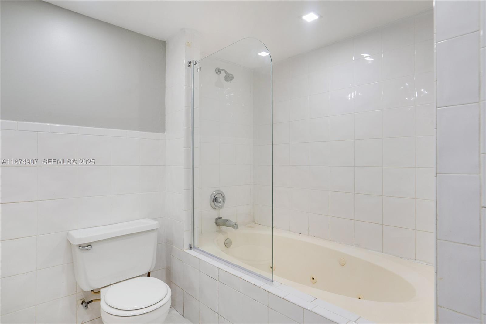 6535 Northwest 6th Avenue Miami, FL 33150 - Photo 8 of 14 a bathroom with a bathtub and toilet