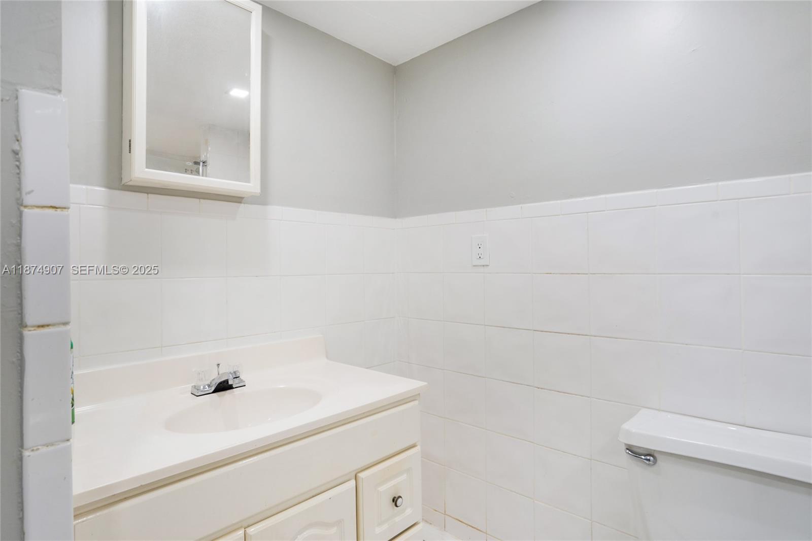6535 Northwest 6th Avenue Miami, FL 33150 - Photo 10 of 14 a bathroom with a sink and a bathtub