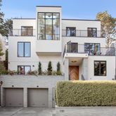 a living room with furniture a rug and a large window