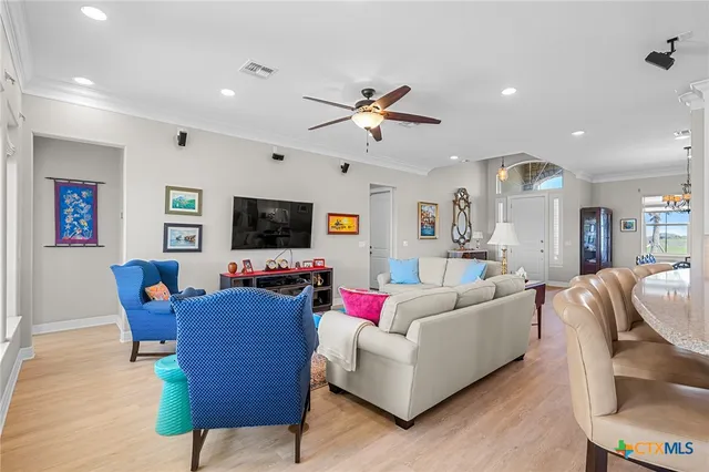 a bedroom with a bed wooden floor and window