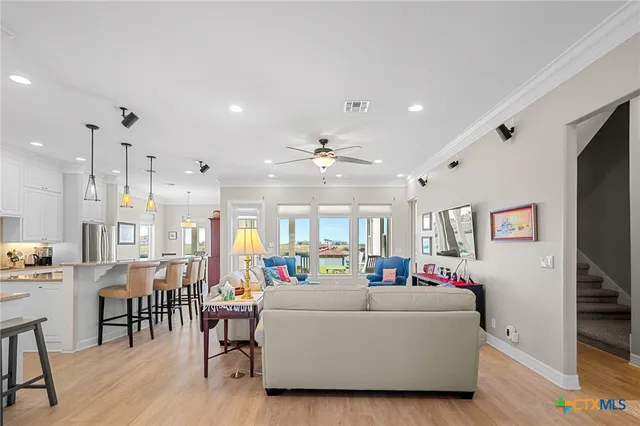 a view of a hallway with wooden shelves