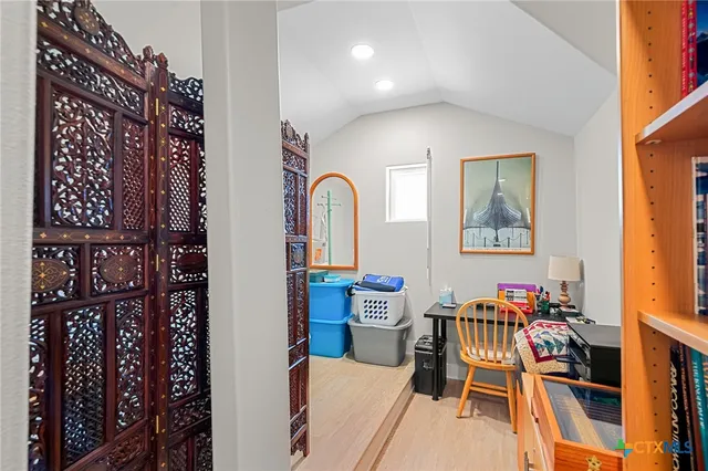 a bedroom with a bed and a table in it