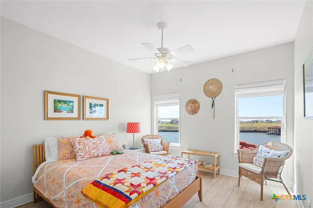 a view of a balcony with furniture and floor to ceiling window