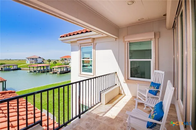 a living room with furniture pool table and flat screen tv