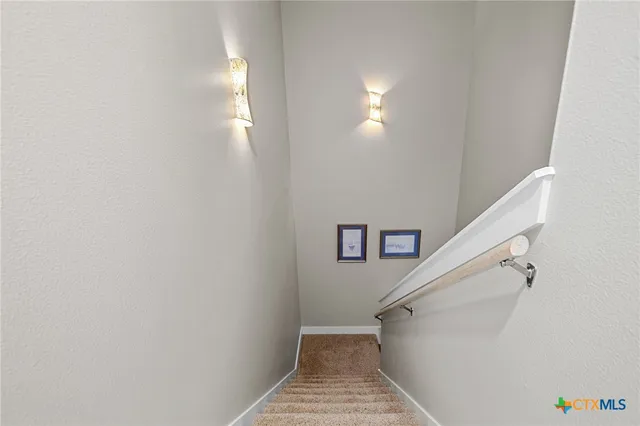 a living room with baby crib and furniture
