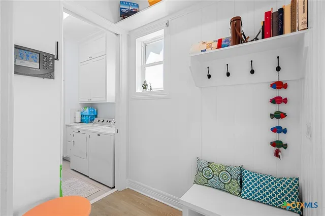 a view of a patio with table and chairs and potted plants