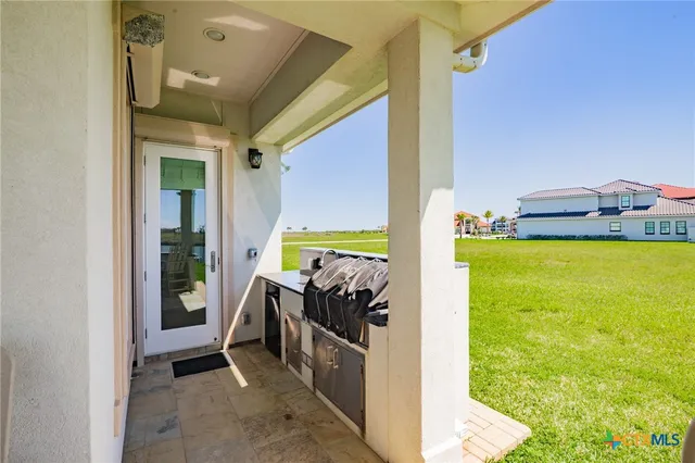 a view of a lake with a house in the background