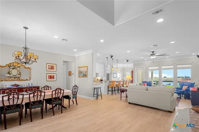 a large kitchen with a table and chairs