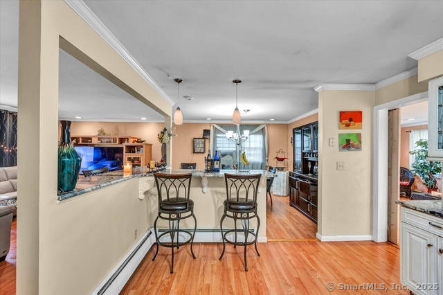 77 Oxbow Lane West Haven, CT 06516 - Photo 13 of 27 a view of a dining room with furniture and wooden floor