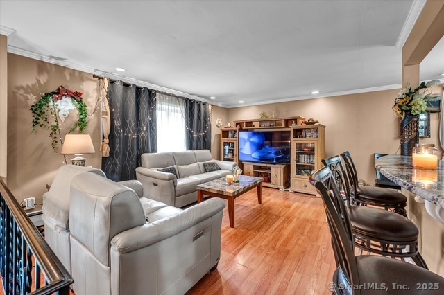 77 Oxbow Lane West Haven, CT 06516 - Photo 14 of 27 a living room with furniture and a flat screen tv