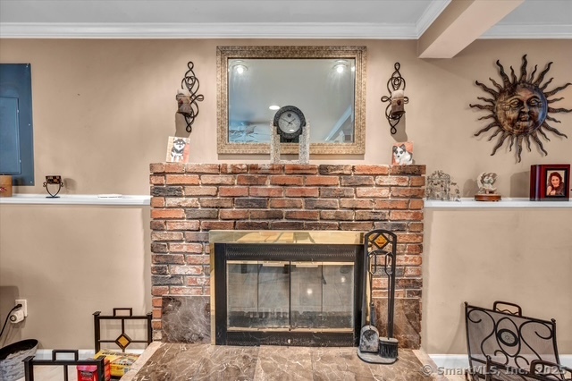 77 Oxbow Lane West Haven, CT 06516 - Photo 25 of 27 a view of living room with furniture and a fireplace