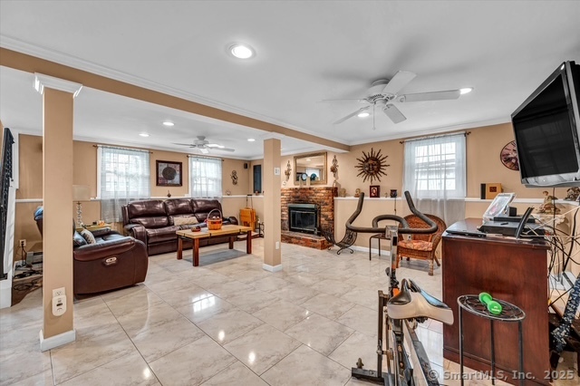 77 Oxbow Lane West Haven, CT 06516 - Photo 26 of 27 a living room with furniture a flat screen tv and a window