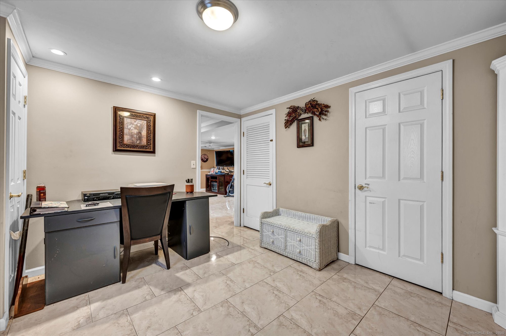 77 Oxbow Lane West Haven, CT 06516 - Photo 27 of 27 a view of a workspace with furniture and cabinet