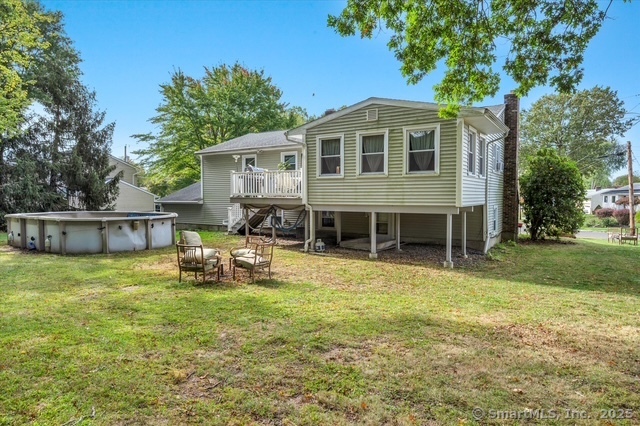 77 Oxbow Lane West Haven, CT 06516 - Photo 6 of 27 a view of a house with a yard and sitting area