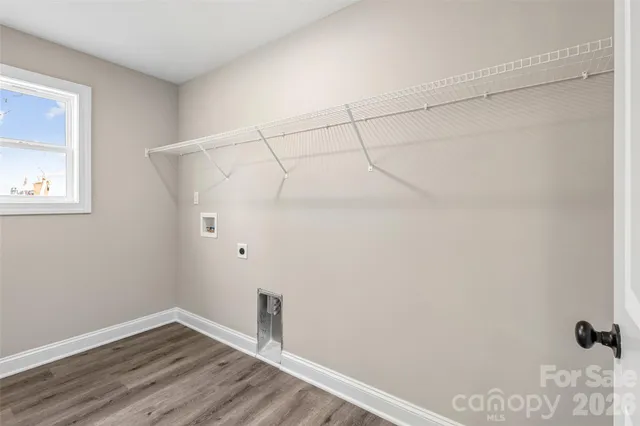 a view of a small space with wooden floor