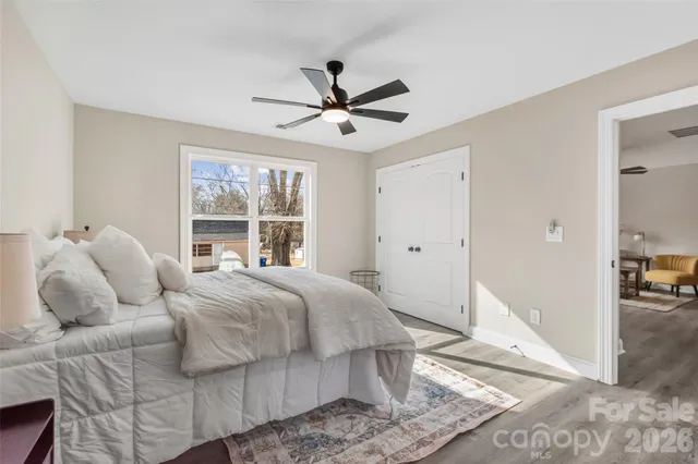 a bed room with a bed and a window