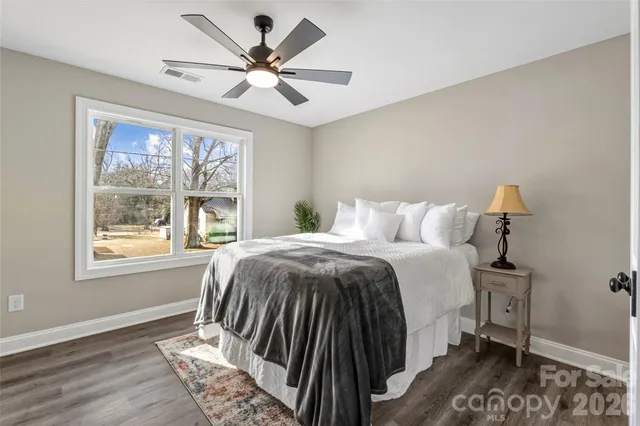 a bedroom with a large bed and a window