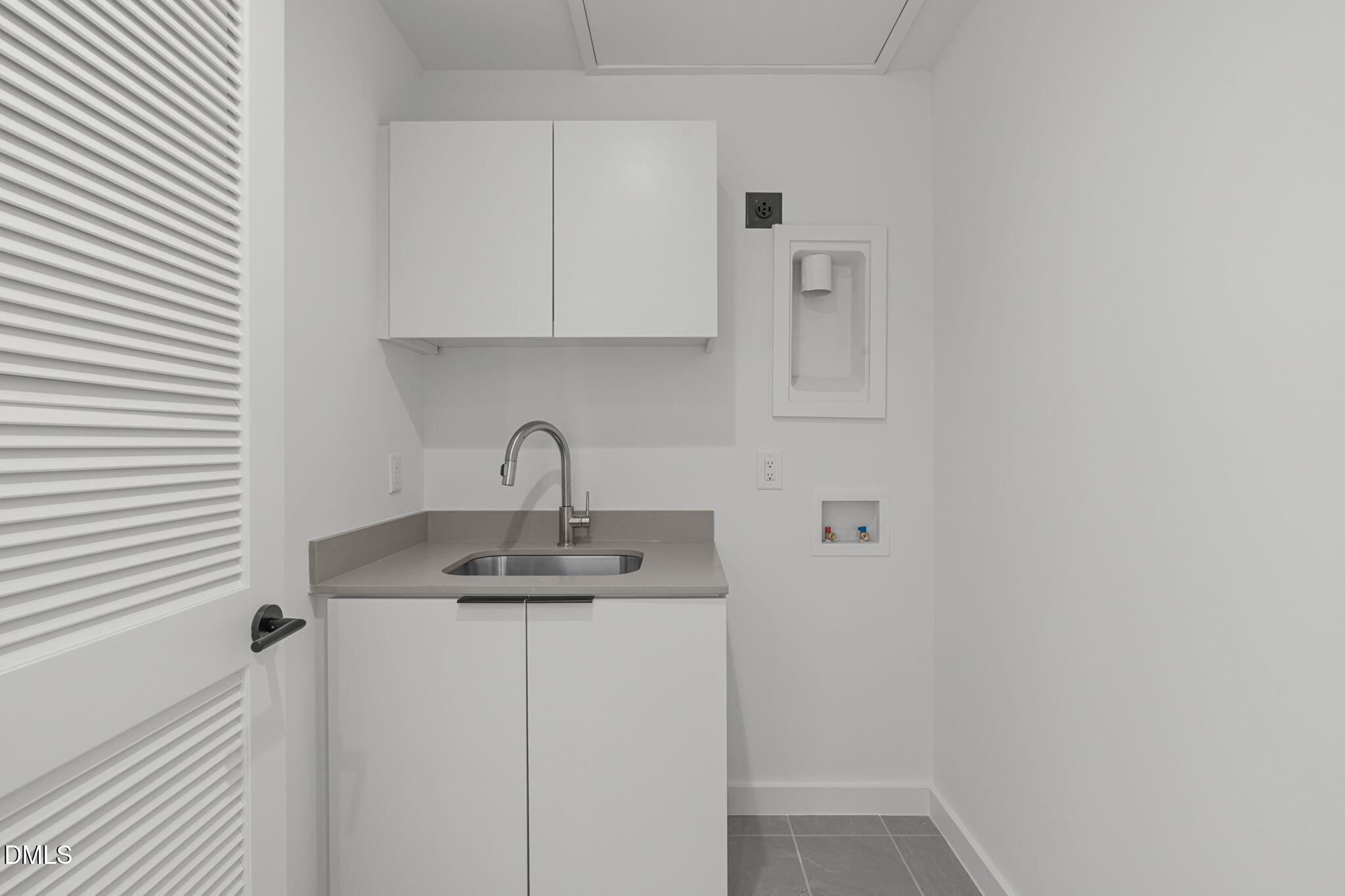 501 South Bloodworth Street, Unit 105 Raleigh, NC 27601 - Photo 41 of 59 a close view of a sink and cabinets