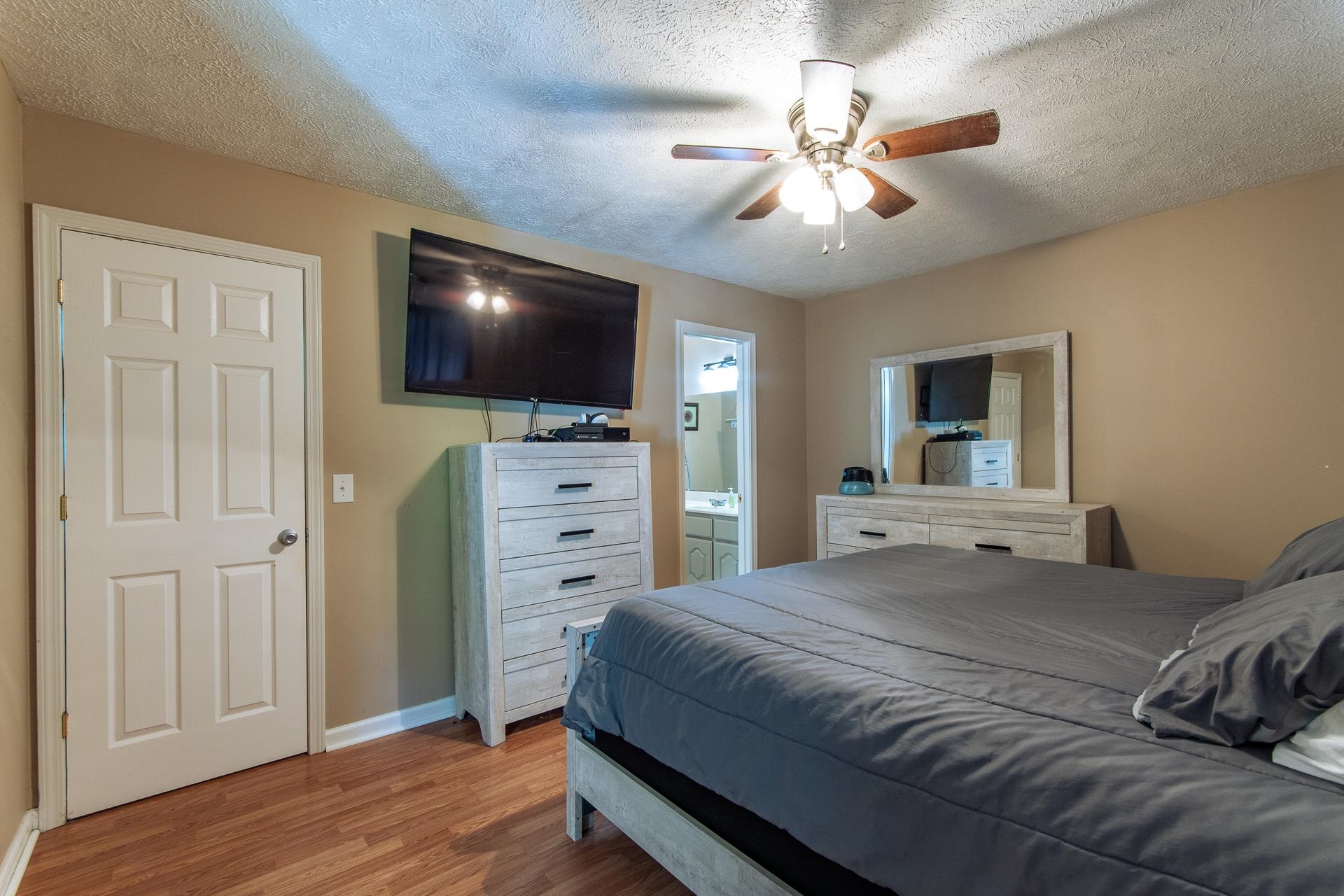 5584 Ramer Selmer Road Selmer, TN 38375 - Photo 14 of 31 a bedroom with a bed and a flat screen tv
